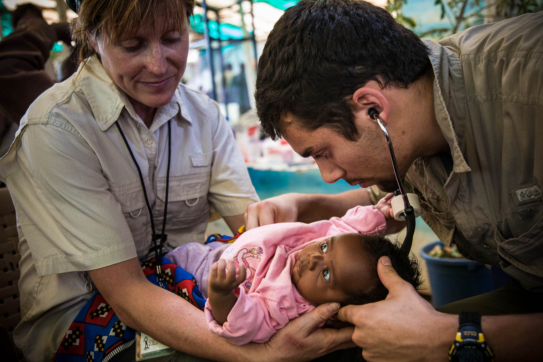 Medics-tend-to-baby-at-humanitarian-aid-station