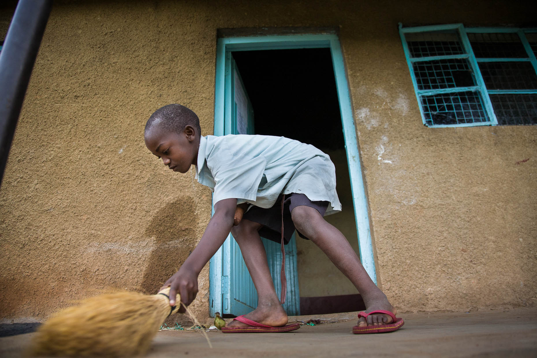 Orphan-sweeping-house-Kenya