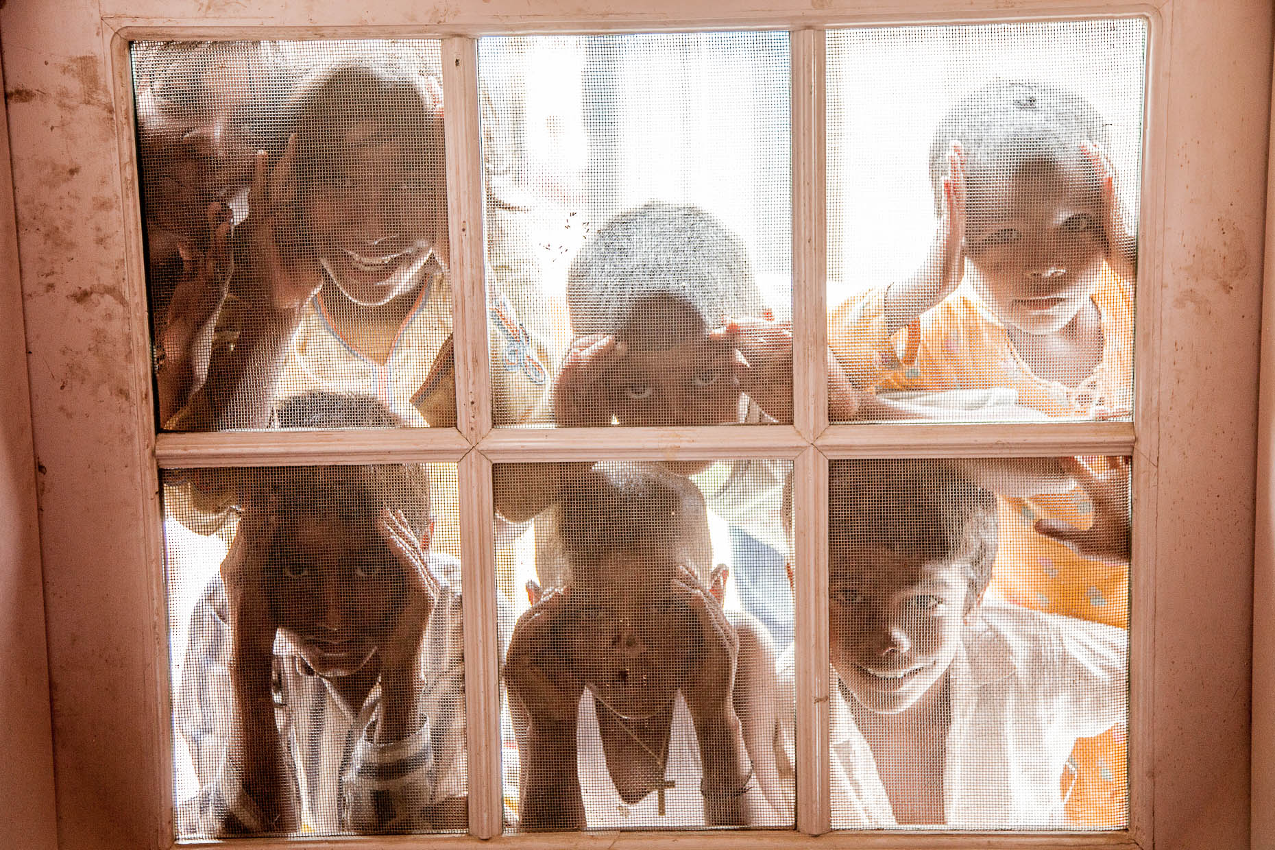 Children-in-Pakistan-look-in-window