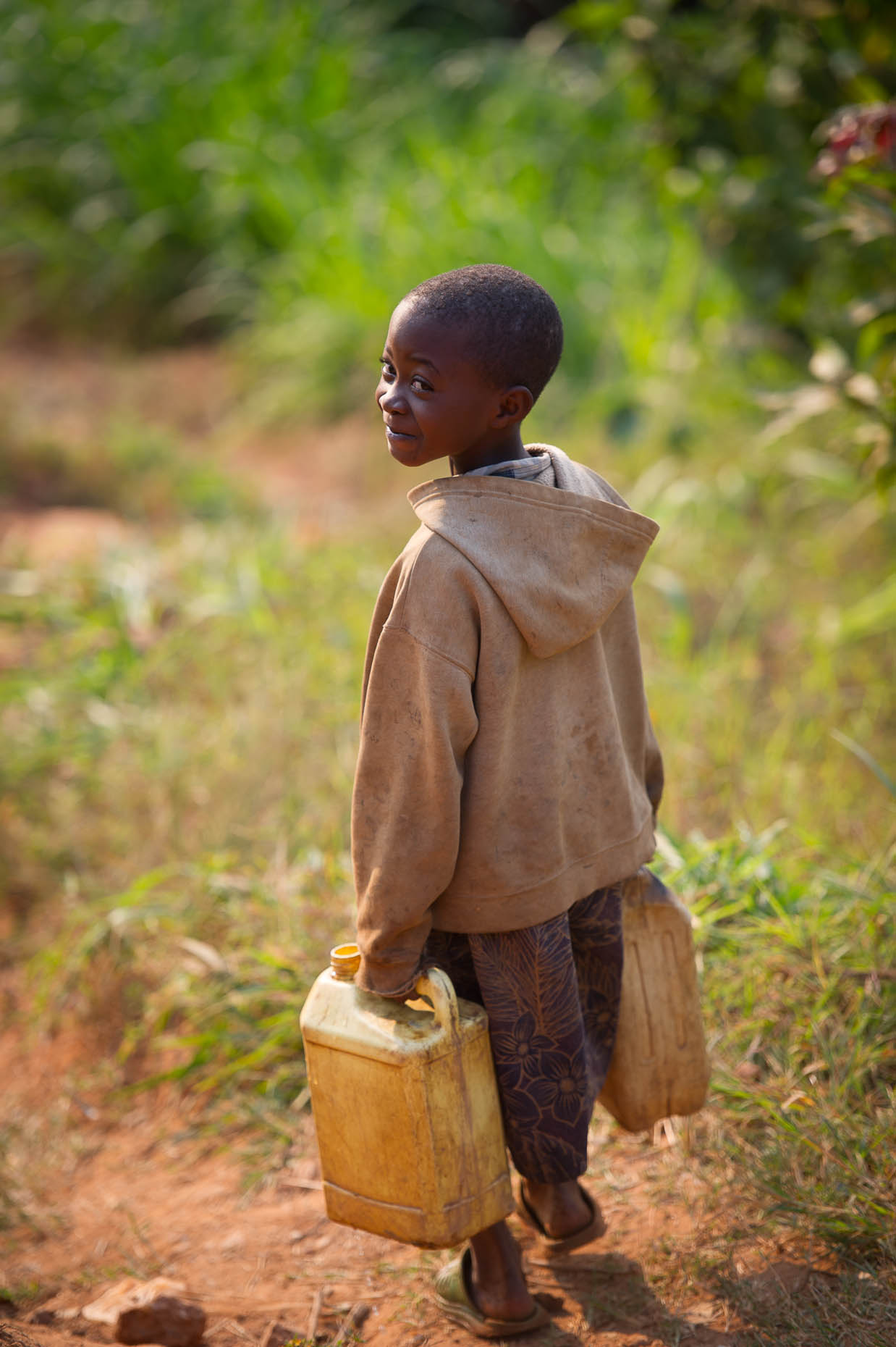 Girl-with-water-cans-Rwanda