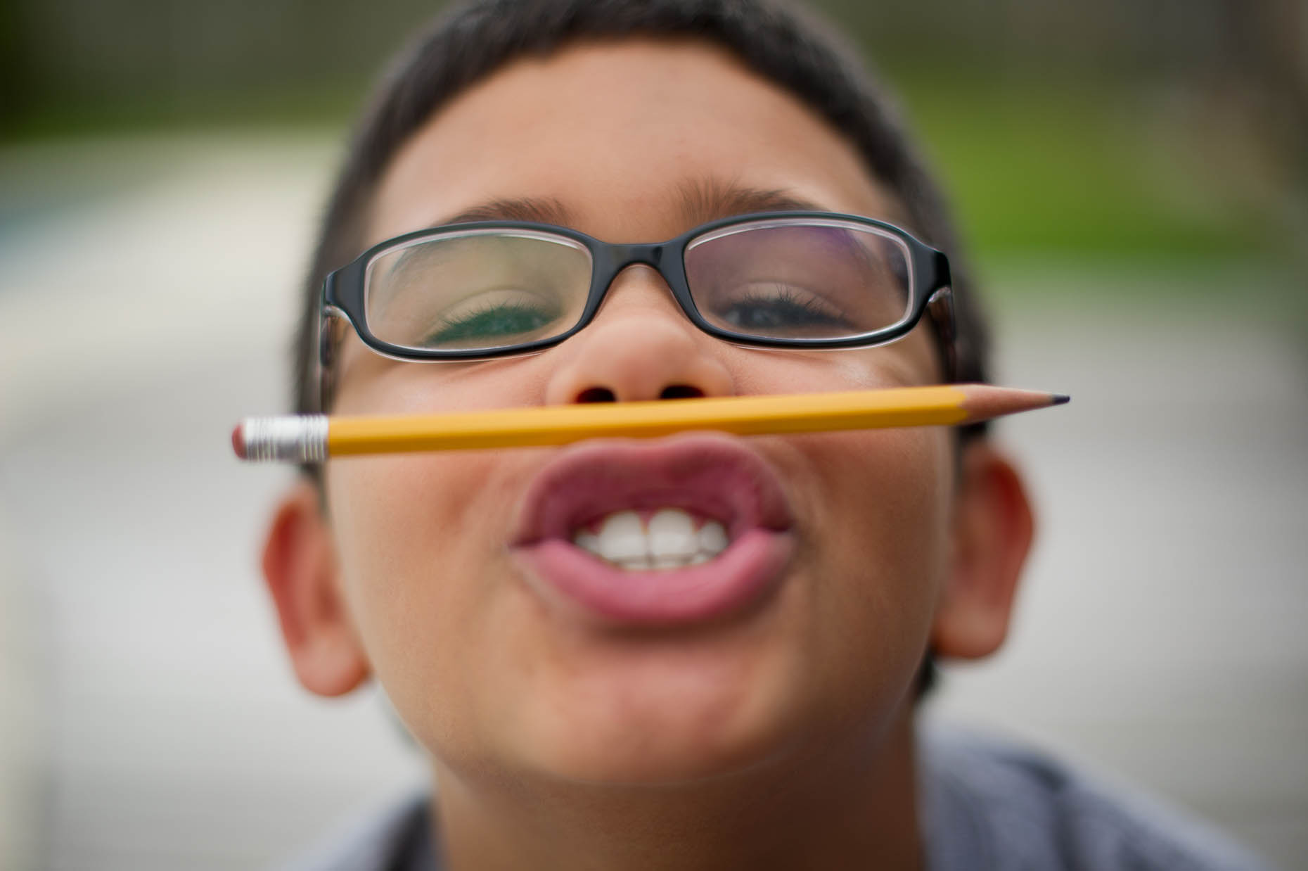 Hispanic-boy-with-pencil-on-lips