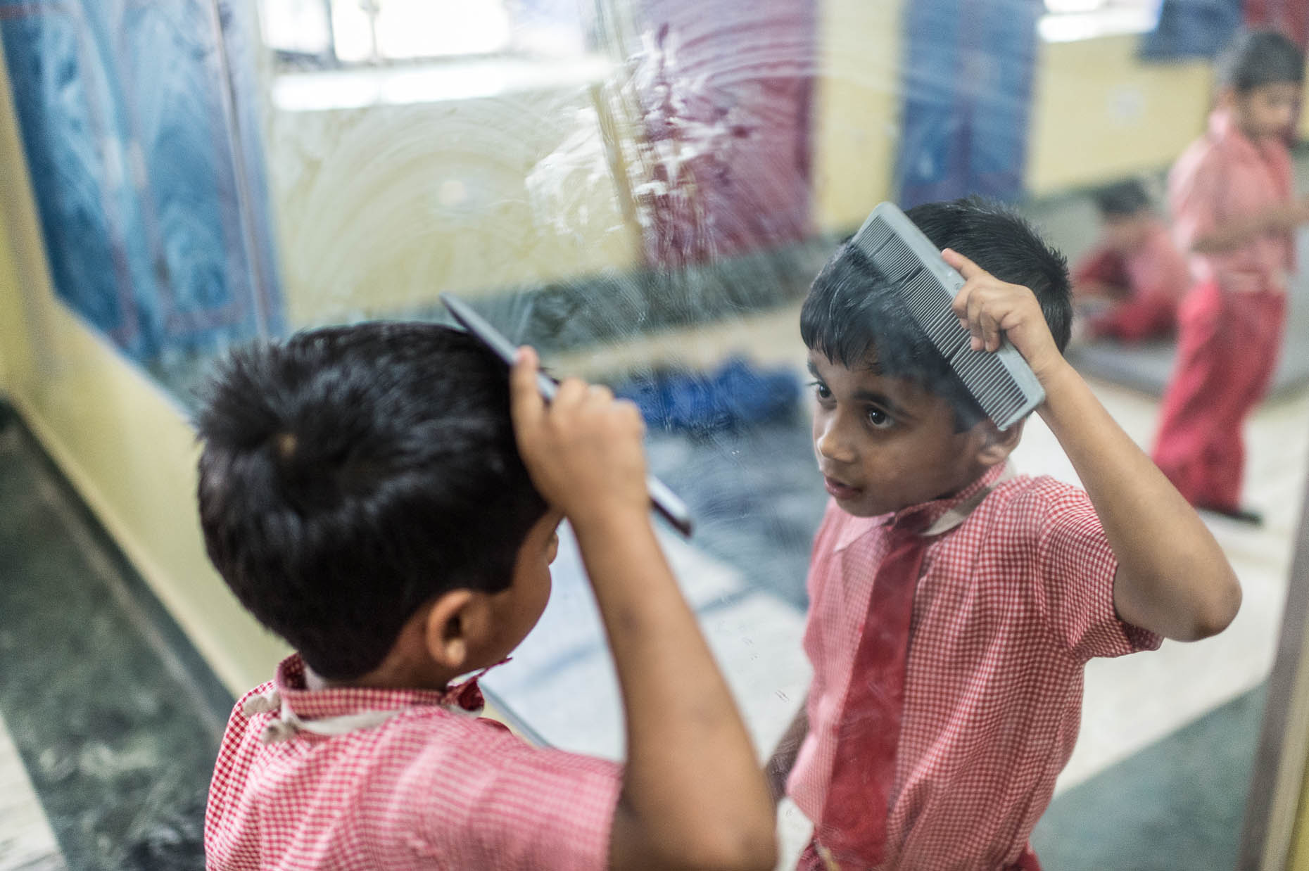 Orphan-combing-hair-India
